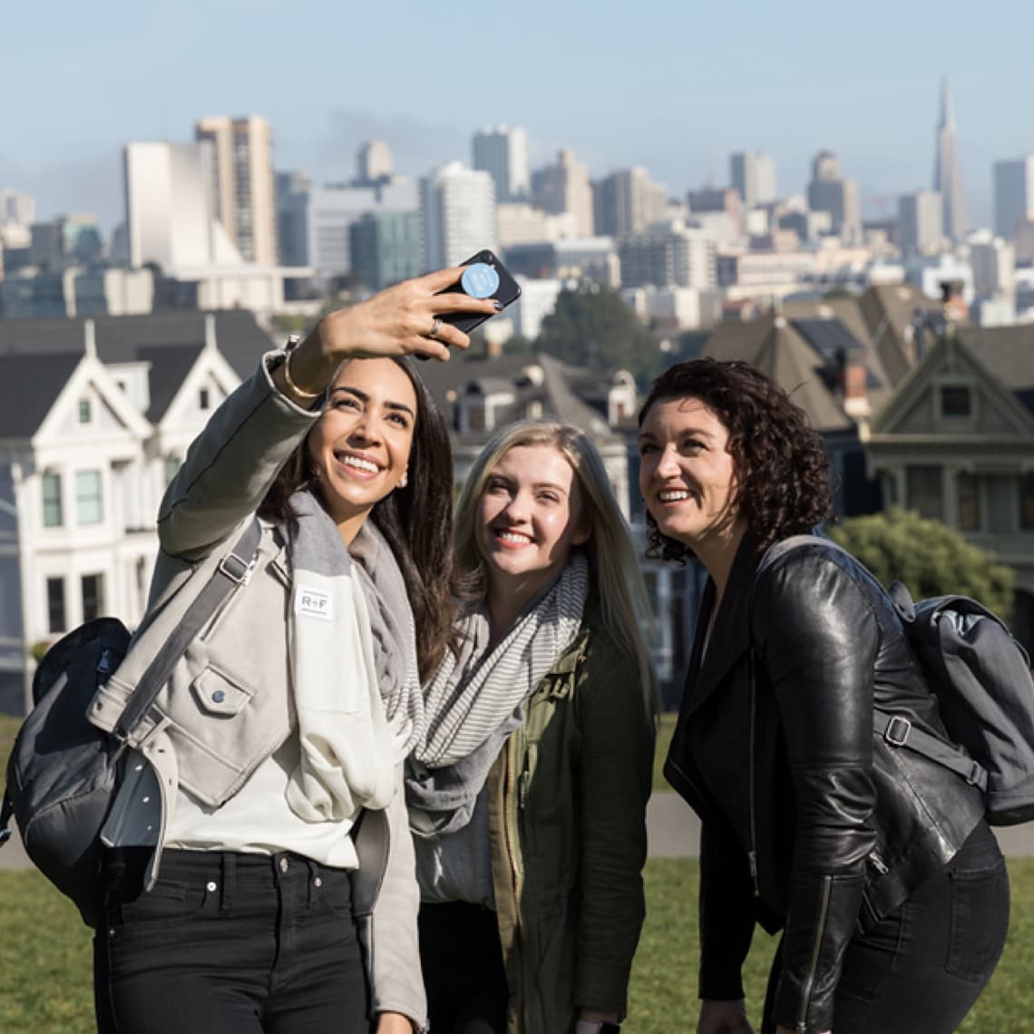 Three women taking a selfie at a park. Three women taking a selfie at a park.